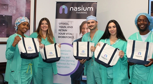 cardiovascular technologists in training reviewing cath-lab imaging results