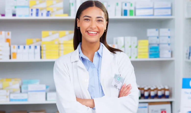 A woman smiling in a pharmacy