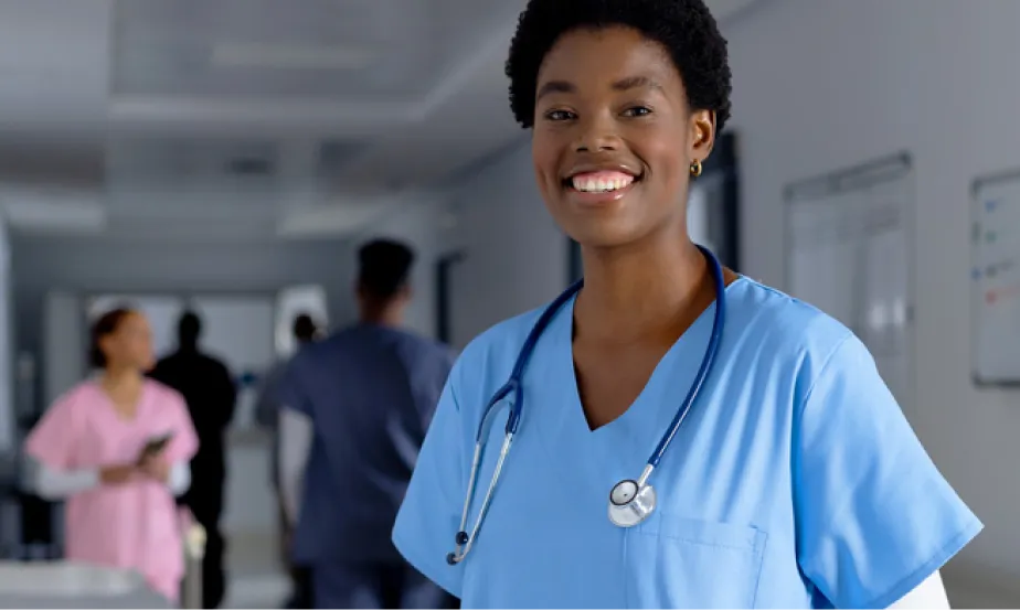 A healthcare professional wearing a stethoscope around her neck